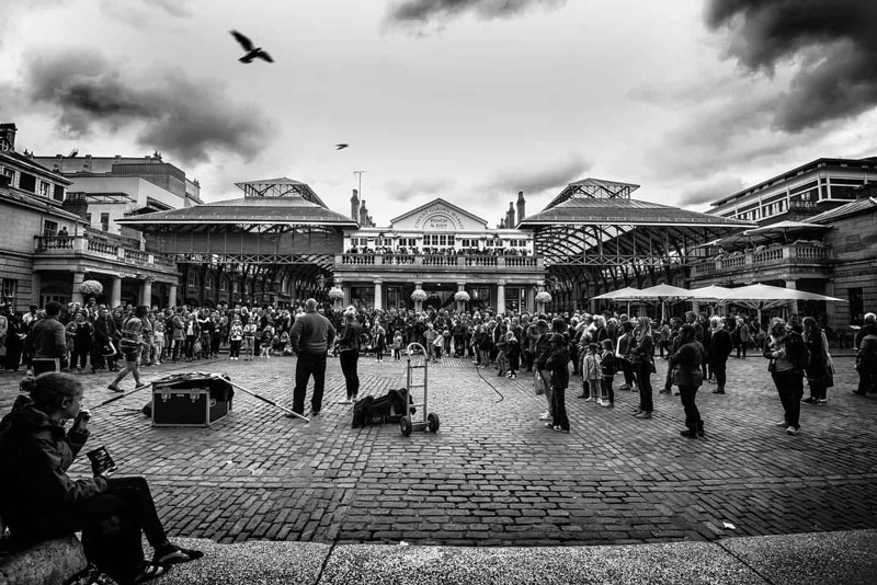 Black and white image of performers at Covent Garden