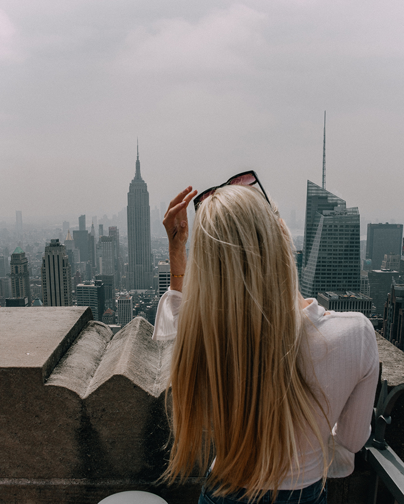 Woman looking out over NYC