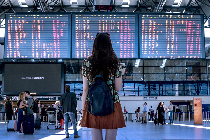 Woman in airport is it weird to travel solo