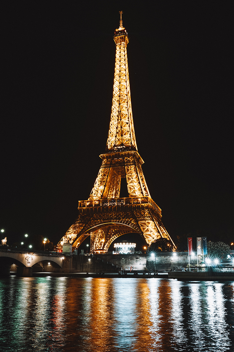 Paris at night the Eiffel Tower along the Seine