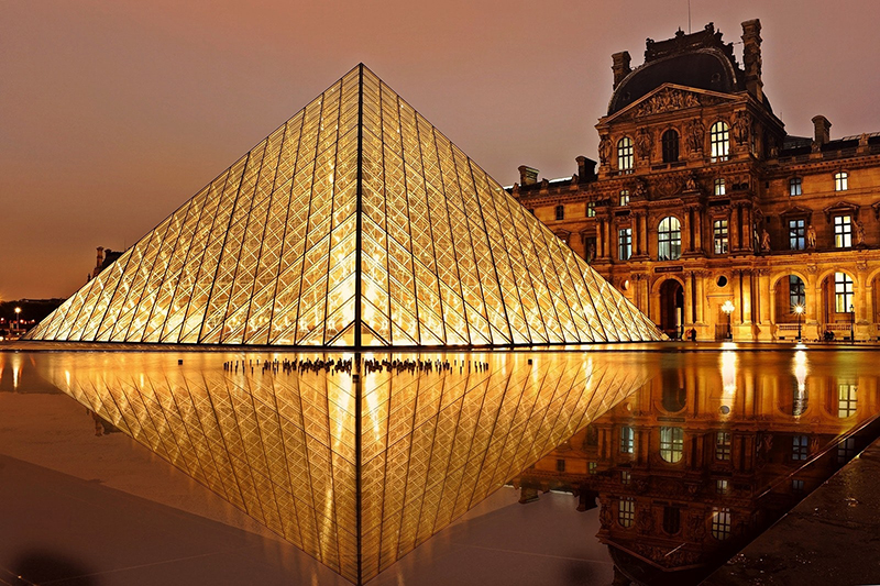 The Louvre Museum in Paris at night 